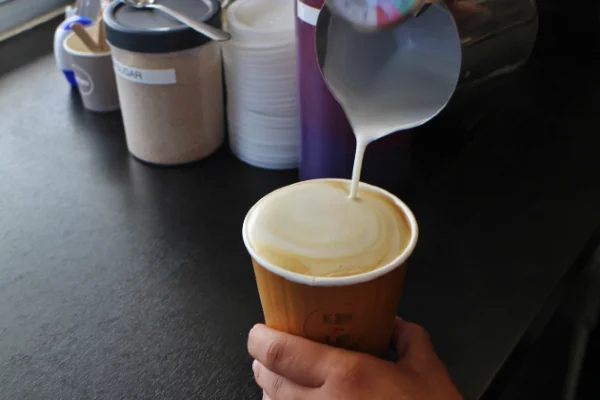 Fair Grinds Co. owner Kahli brewing some coffee.